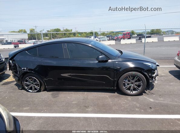 7SAYGDEE4SA359124 2025 TESLA MODEL Y Black Սալոնի հետևի տեսք