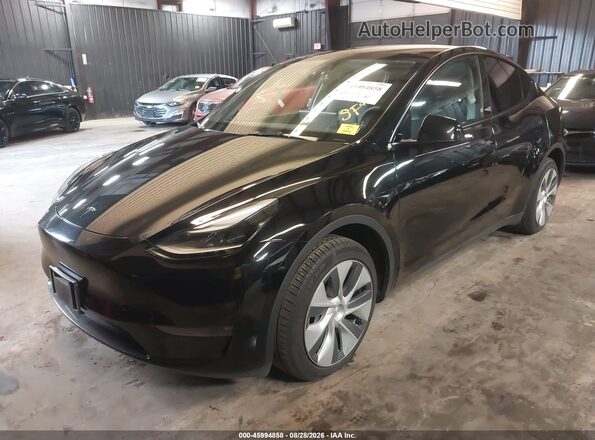 7SAYGDEE5PA180100 2023 TESLA MODEL Y Black Առջևի ձախ երեք քառորդ տեսարան