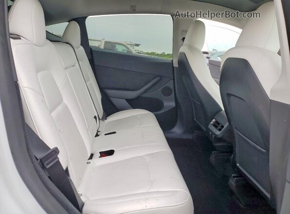 7SAYGDEE5PF775435 2023 TESLA MODEL White Vista de los asientos traseros