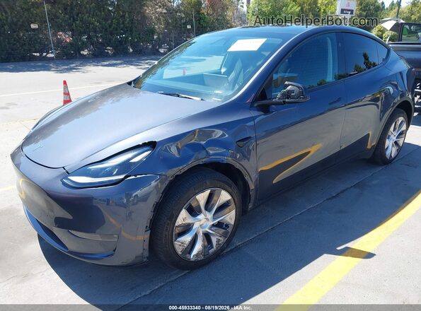 7SAYGDEE6PA194667 2023 TESLA MODEL Y Gray Vista tres cuartos delantera izquierda