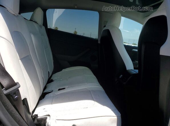 7SAYGDEE6RF069092 2024 TESLA MODEL Black Vista de los asientos traseros