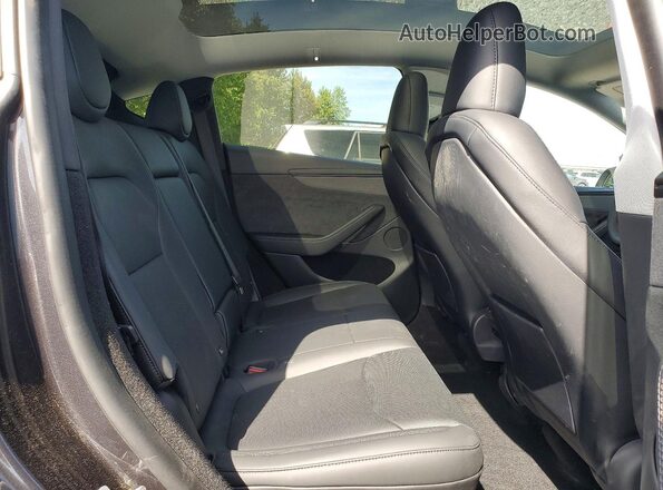 7SAYGDEE7TF517668 2026 TESLA MODEL Charcoal Widok wnętrza z tyłu