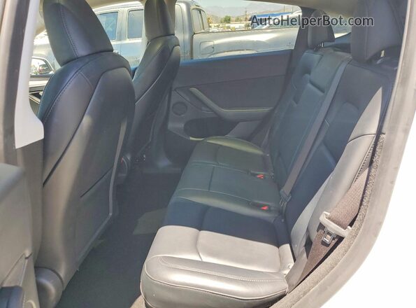 7SAYGDEE8PF857899 2023 TESLA MODEL White Rear seats view