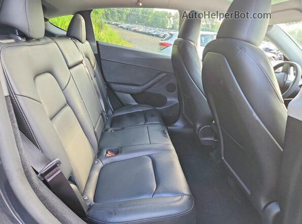 7SAYGDEE8RF988821 2024 TESLA MODEL Charcoal Vista de los asientos traseros