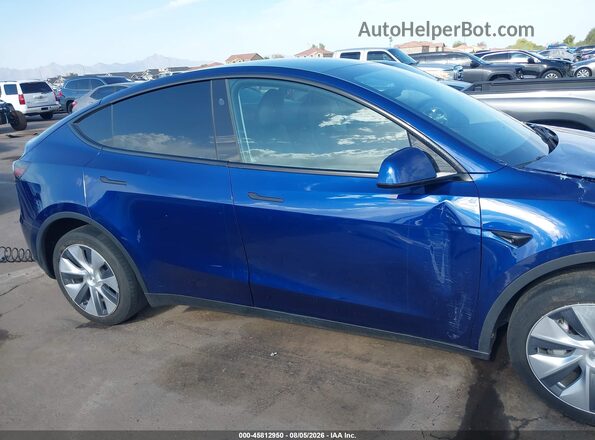 7SAYGDEE9PA166524 2023 TESLA MODEL Y Blue Սալոնի հետևի տեսք