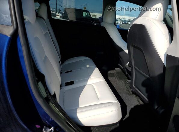 7SAYGDEE9RF064257 2024 TESLA MODEL Blue Rear seats view