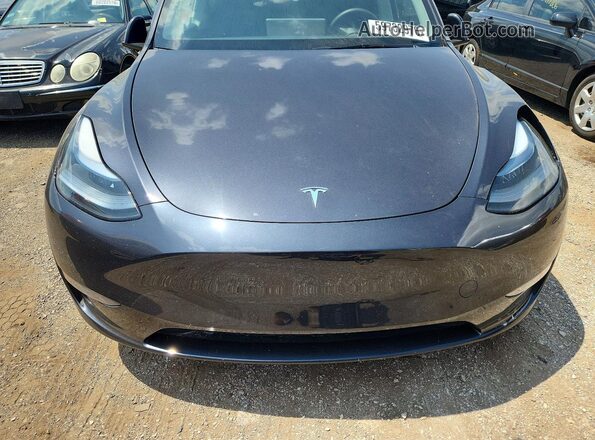 7SAYGDEE9RF199173 2024 TESLA MODEL Charcoal Rear interior view