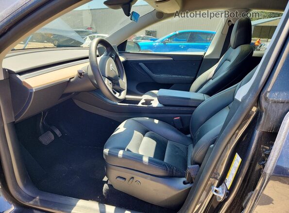 7SAYGDEEXRA238138 2024 TESLA MODEL Charcoal Front interior view