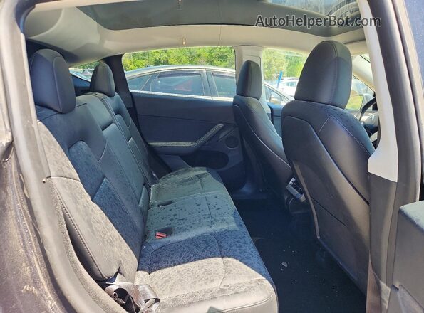 7SAYGDEEXRA238138 2024 TESLA MODEL Charcoal Rear interior view