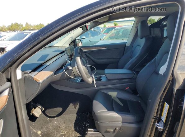 7SAYGDEEXRF206373 2024 TESLA MODEL Black Front interior view