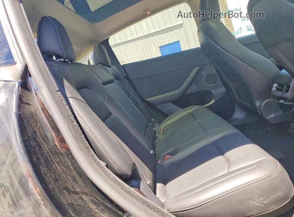 7SAYGDEEXRF206373 2024 TESLA MODEL Black Rear seats view