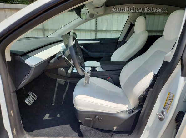 7SAYGDEF1PF809282 2023 TESLA MODEL White Front interior view