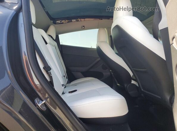 7SAYGDEF6SF243287 2025 TESLA MODEL Угольный Вид задней части салона