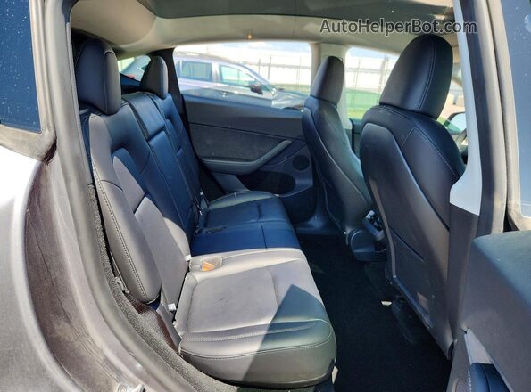 7SAYGDEF9SF299272 2025 TESLA MODEL Серый Вид задних сидений