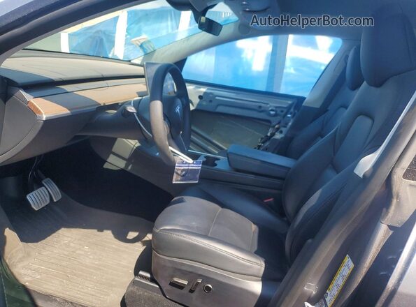 7SAYGDEFXRF170046 2024 TESLA MODEL Gray Front interior view