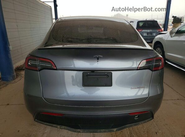 7SAYGDEFXRF170046 2024 TESLA MODEL Gray Rear view