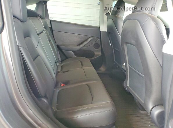 7SAYGDEFXRF170046 2024 TESLA MODEL Gray Rear seats view