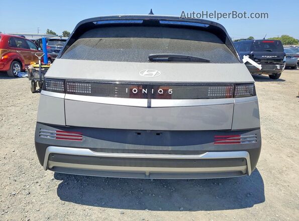 7YAKM4DA2SY011604 2025 HYUNDAI IONIQ Gray Вид ззаду