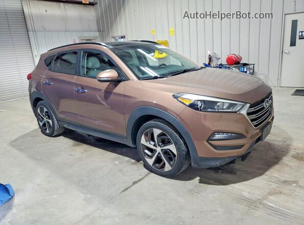 KM8J3CA21GU137542 2016 HYUNDAI TUCSON Коричневый Вид спереди