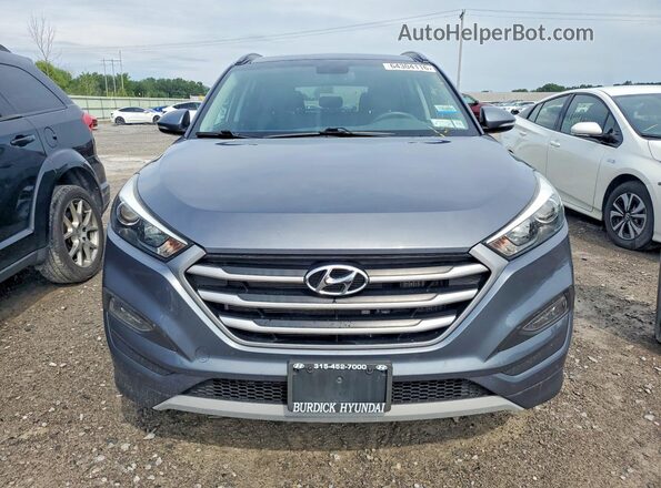 KM8J3CA2XJU757863 2018 HYUNDAI TUCSON Gray Widok z tyłu