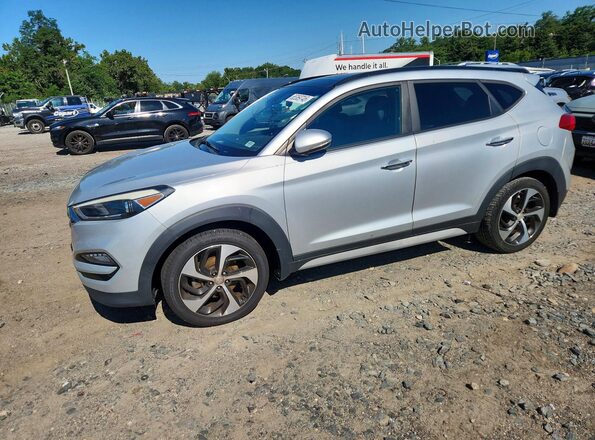 KM8J3CA23JU615371 2018 HYUNDAI TUCSON Silver Trasero izquierdo