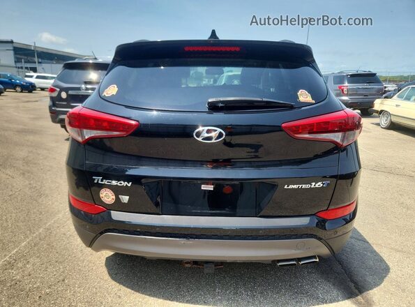 KM8J33A23GU129541 2016 HYUNDAI TUCSON Black წინა სალონის ხედი