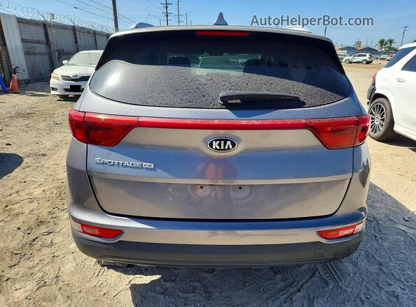 KNDPM3AC8K7559075 2019 KIA SPORTAGE Silver Vista interior delantera
