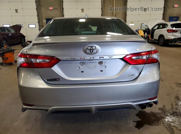 4T1B11HK0KU739975 2019 TOYOTA CAMRY Серебряный Вид салона спереди