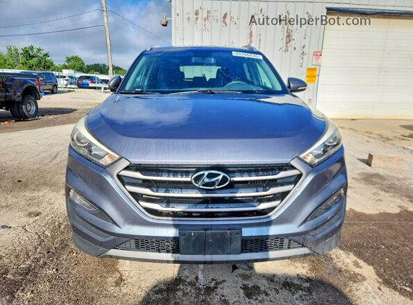 KM8J3CA26GU050249 2016 HYUNDAI TUCSON Gray უკანა ხედი