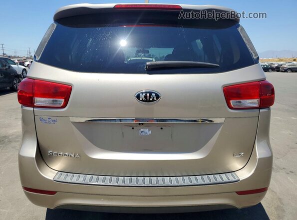 KNDMB5C18G6140138 2016 KIA SEDONA Tan Вид салону спереду