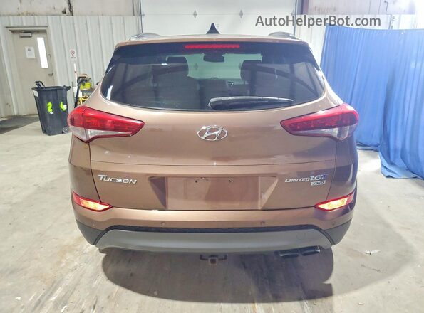 KM8J3CA21GU137542 2016 HYUNDAI TUCSON Коричневый Вид салона спереди