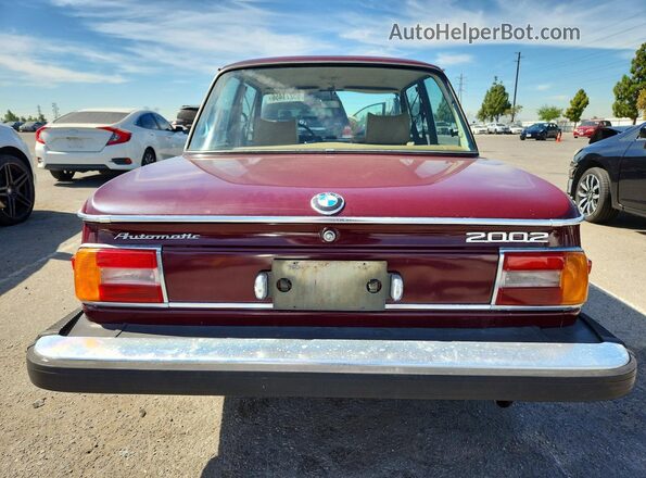 4282385 1974 BMW 2000 Burgundy Вид салону спереду
