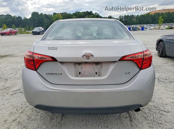 5YFBURHE3KP896868 2019 TOYOTA COROLLA Серебряный Вид салона спереди