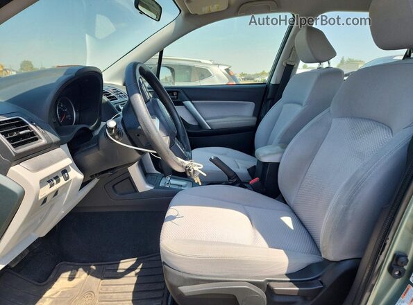 JF2SJABC9HH809952 2017 SUBARU FORESTER Teal Widok wnętrza z przodu
