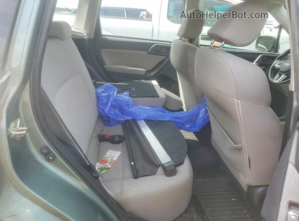 JF2SJABCXHH561520 2017 SUBARU FORESTER Green Rear interior view