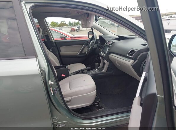 JF2SJADC5GH401427 2016 SUBARU FORESTER Green Front interior view