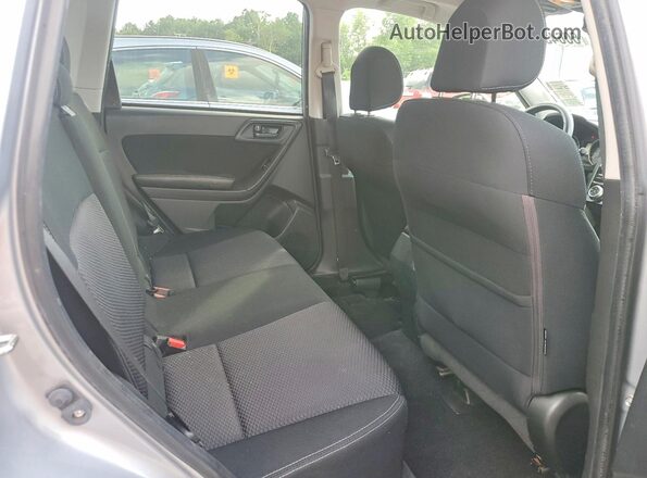 JF2SJADC5GH561713 2016 SUBARU FORESTER Silver Vista interior trasera