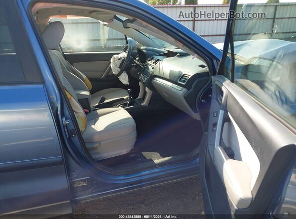 JF2SJADC6GG546112 2016 SUBARU FORESTER Blue Front interior view