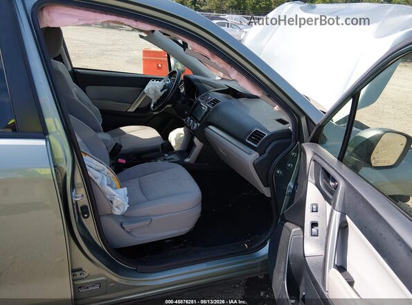 JF2SJADCXGH552277 2016 SUBARU FORESTER Green Front interior view