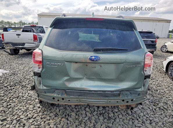 JF2SJAEC8JH431561 2018 SUBARU FORESTER Green Rear view