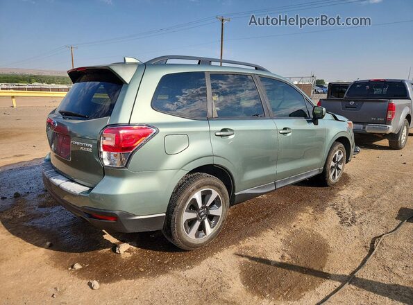 JF2SJAGC4HH545211 2017 SUBARU FORESTER Green Trasero derecho