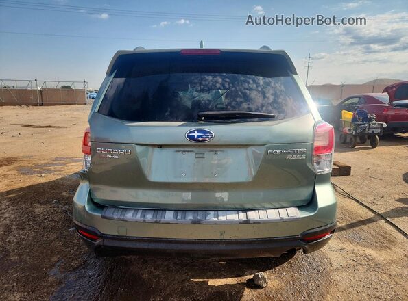 JF2SJAGC4HH545211 2017 SUBARU FORESTER Green Vista trasera