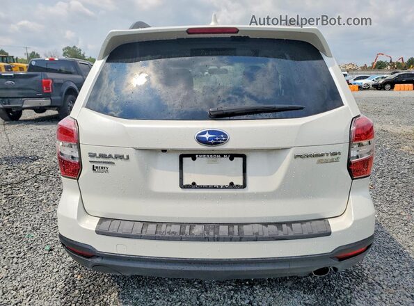 JF2SJAHC1GH476958 2016 SUBARU FORESTER White Rear view