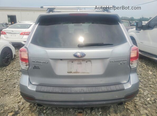 JF2SJGWC6HH451514 2017 SUBARU FORESTER Silver Rear view