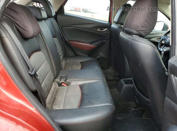 JM1DKBC79G0111799 2016 MAZDA CX-3 Red Vista de los asientos traseros