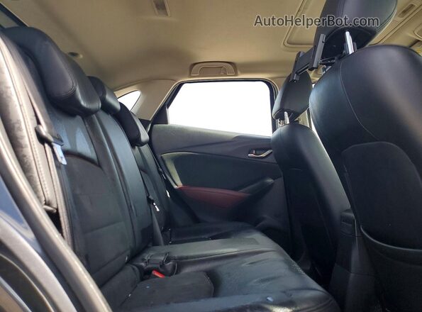 JM1DKFD79H0165787 2017 MAZDA CX-3 Gray Vista de los asientos traseros