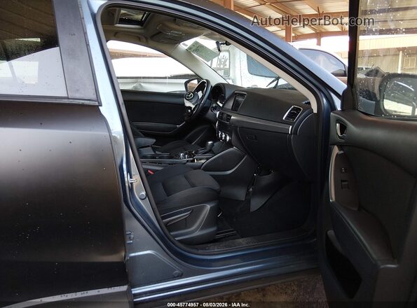 JM3KE2CYXG0800748 2016 MAZDA CX-5 Black Вид салону спереду