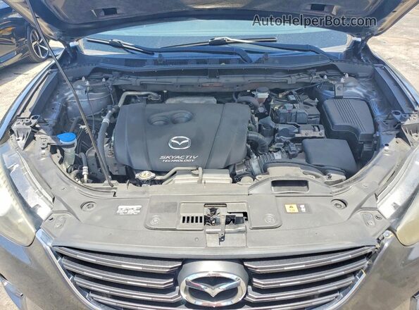 JM3KE2CYXG0900641 2016 MAZDA CX-5 Gray Widok wnętrza z tyłu