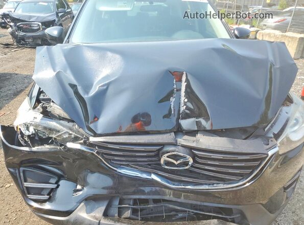 JM3KE4BY3G0899121 2016 MAZDA CX-5 Black Rear interior view
