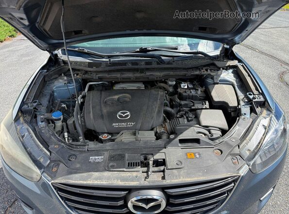 JM3KE4DY6G0655895 2016 MAZDA CX-5 Blue Вид салону спереду